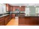 Modern kitchen featuring stainless steel appliances, granite countertops, and a functional center island at 1822 Routh Rd, Burlington, NC 27217