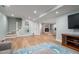 Open-concept living room features a fireplace, stairs, and hardwood floors at 1822 Routh Rd, Burlington, NC 27217