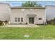 Spacious backyard with lush lawn, patio area, and a well-maintained exterior of the house at 1833 Creek Oak Circle Cir, Fuquay Varina, NC 27526