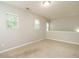Neutral empty bedroom with 3 large windows allowing for plenty of natural light at 1833 Creek Oak Circle Cir, Fuquay Varina, NC 27526