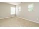 Neutral empty bedroom with large windows allowing for plenty of natural light at 1833 Creek Oak Circle Cir, Fuquay Varina, NC 27526