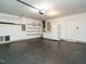 Spacious two car garage with shelving, a freezer and large utility sink at 1833 Creek Oak Circle Cir, Fuquay Varina, NC 27526