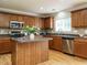 Kitchen with stainless steel appliances, center island, and tile backsplash at 1833 Creek Oak Circle Cir, Fuquay Varina, NC 27526