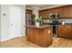 Kitchen with stainless steel appliances, kitchen island, and tiled backsplash at 1833 Creek Oak Circle Cir, Fuquay Varina, NC 27526