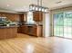 Updated kitchen boasts wood cabinets, stainless steel appliances, and backyard access at 1833 Creek Oak Circle Cir, Fuquay Varina, NC 27526