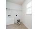 White laundry room featuring tile floor, patterned wall paper and utility hook ups at 1833 Creek Oak Circle Cir, Fuquay Varina, NC 27526