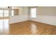 Bright living room with hardwood floors, a fireplace, white trim and neutral paint colors at 1833 Creek Oak Circle Cir, Fuquay Varina, NC 27526