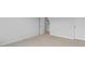 Bright bedroom features neutral carpet, white walls and trim and an open door at 191 Ethel Ln, Angier, NC 27501