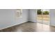 Bright bedroom with plush carpeting and backyard views through sliding glass doors at 191 Ethel Ln, Angier, NC 27501