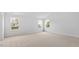 Large bedroom with ample natural light and three large windows at 191 Ethel Ln, Angier, NC 27501