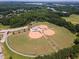 Aerial view of the baseball fields at the park with lush green trees in the background at 1912 Parkside Village Dr, Clayton, NC 27520