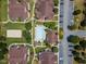 Overhead view of condos with private pool, landscaping, parking lot and walking paths at 1912 Parkside Village Dr, Clayton, NC 27520