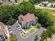 Elevated aerial perspective captures a multi-story residential building amidst lush trees, with visible parking at 1912 Parkside Village Dr, Clayton, NC 27520
