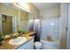 A bathroom with a bathtub, toilet, mirror, sink, and decorative plants for added elegance at 1912 Parkside Village Dr, Clayton, NC 27520