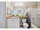 Well-lit bathroom features a modern vanity, toilet, and tub-shower combination at 1912 Parkside Village Dr, Clayton, NC 27520