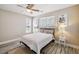 Comfortable bedroom enhanced by natural light, ceiling fan and calming ambiance at 1912 Parkside Village Dr, Clayton, NC 27520