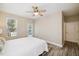 Bright bedroom featuring a ceiling fan and access to the outdoors at 1912 Parkside Village Dr, Clayton, NC 27520