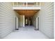 Exterior view of the building's entrance, showcasing the covered walkway, doors, and stairway access at 1912 Parkside Village Dr, Clayton, NC 27520