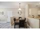 Dining area with modern table and chairs next to the living area at 1912 Parkside Village Dr, Clayton, NC 27520