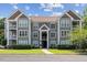 An exterior view showcasing the well-maintained building, landscaping, and architectural features at 1912 Parkside Village Dr, Clayton, NC 27520