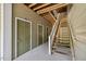 Exterior view showing the stairway leading to upper level units with green doors to units at 1912 Parkside Village Dr, Clayton, NC 27520