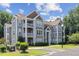 Beautiful condominium complex with traditional architectural details, private balconies and well-maintained landscaping at 1912 Parkside Village Dr, Clayton, NC 27520