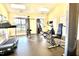 Well-equipped fitness center with modern exercise machines and natural light from large windows at 1912 Parkside Village Dr, Clayton, NC 27520