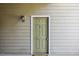 View of front door on porch with green paint at 1912 Parkside Village Dr, Clayton, NC 27520