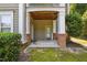 Covered porch with brick and wood columns at 1912 Parkside Village Dr, Clayton, NC 27520