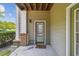 Front porch with brick columns and wood ceiling at 1912 Parkside Village Dr, Clayton, NC 27520
