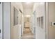 Hallway with wood-look floors leading to a bathroom and bedroom at 1912 Parkside Village Dr, Clayton, NC 27520