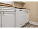 Close-up of the kitchen dishwasher and cabinets with updated hardware and finishes at 1912 Parkside Village Dr, Clayton, NC 27520