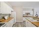 The kitchen is equipped with modern appliances, white cabinets, and generous counter space at 1912 Parkside Village Dr, Clayton, NC 27520