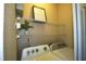 Laundry room with a Whirlpool washer and dryer, wire rack shelving, and decor at 1912 Parkside Village Dr, Clayton, NC 27520