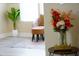 Bright floral arrangement on a side table, located near a sitting room featuring a comfortable chair at 1912 Parkside Village Dr, Clayton, NC 27520