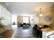 Open-concept living and dining area features modern decor, comfortable seating, and ample natural light at 1912 Parkside Village Dr, Clayton, NC 27520