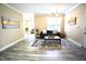 Inviting living room featuring hardwood floors and neutral paint colors at 1912 Parkside Village Dr, Clayton, NC 27520