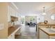 Bright open-concept living space with a view of the kitchen and lots of natural light at 1912 Parkside Village Dr, Clayton, NC 27520