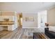Open-concept living space with wood floors, modern decor, and plenty of natural light at 1912 Parkside Village Dr, Clayton, NC 27520