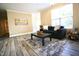 Living room with modern decor, comfortable seating, and ample natural light, creating a welcoming space at 1912 Parkside Village Dr, Clayton, NC 27520