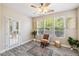 Cozy sitting area with wood floors, natural light, and a view of the outdoors at 1912 Parkside Village Dr, Clayton, NC 27520