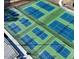 Aerial view of newly constructed tennis courts with green and blue surfaces, promising an active lifestyle at 1912 Parkside Village Dr, Clayton, NC 27520