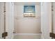 Walk-in closet featuring a custom shelving system and ample storage space at 1912 Parkside Village Dr, Clayton, NC 27520