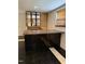 Basement bar area with tiled floor and drop ceiling at 210 Crest Rd, Henderson, NC 27536