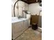 Utility area with white washer, dryer, and hot water heater at 210 Crest Rd, Henderson, NC 27536