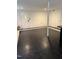 Spacious partially finished basement with drop ceiling and black and white flooring at 210 Crest Rd, Henderson, NC 27536