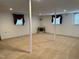 Spacious basement with carpet and natural light perfect for recreational activities or storage at 210 Crest Rd, Henderson, NC 27536