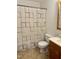 Cozy bathroom featuring a shower with modern fixtures, toilet, and vanity sink at 210 Crest Rd, Henderson, NC 27536