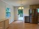 Bright dining area with stainless steel appliances, opening to a deck perfect for outdoor dining at 210 Crest Rd, Henderson, NC 27536