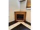 Corner fireplace with tiled floor and white walls at 210 Crest Rd, Henderson, NC 27536